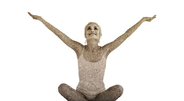 Toned young woman sitting with arms outstretched against astro turf surface