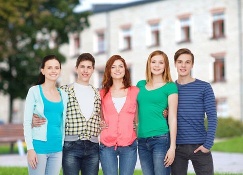 education and people concept - group of smiling students standing