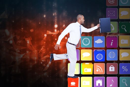 Businessman running with briefcase against abstract background