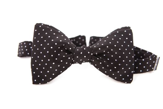 Accessory for a gentleman bow tie. Made of linen fabric. Black with white polka dots.