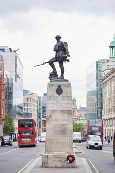 LONDON, UK - JUNE 23: Royal Fusiliers war memorial, by Albert Toft, in between traffic lanes in Chancery Lane. June 23, 2015 in London.