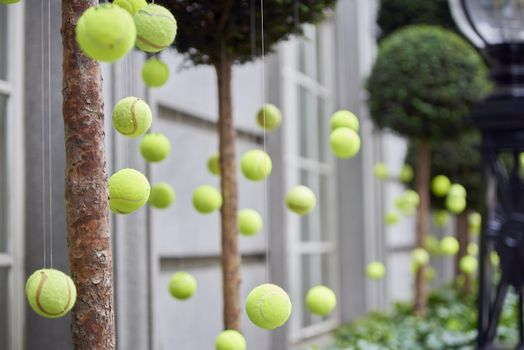 LONDON, UK - JUNE 23: Tennis balls decoration in front of Rosewood Hotel. June 23, 2015 in London. Two main tennis competitions in the UK take place in June: The Aegon Championships and Wimbledon.
