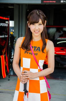 BURIRAM - JUNE 20: Unidentified Race Queen of Japan with racing car on display at The 2015 Autobacs Super GT Series Race 3 on June 20, 2015 at Chang International Racing Circuit, Buriram Thailand