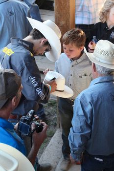 MERRITT; B.C. CANADA - May 30; 2015: Fans receiving autographs at The 3rd Annual Ty Pozzobon Invitational PBR Event.