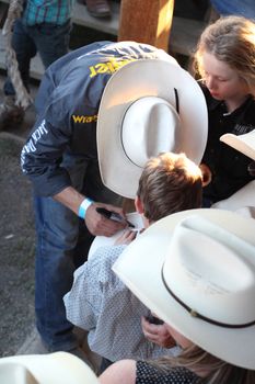 MERRITT; B.C. CANADA - May 30; 2015: Fans receiving autographs at The 3rd Annual Ty Pozzobon Invitational PBR Event.