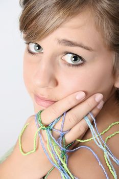 Innocent looking teenager with small beaded strings