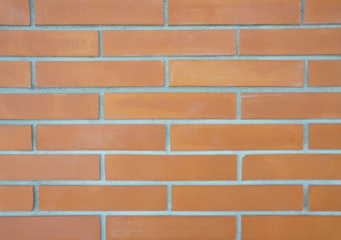 Rectangular shape with a brown brick was put together in a wall.                               