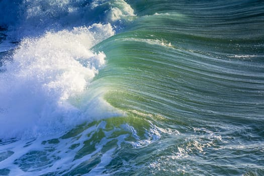 Texture of Ocean wave at sunset time.