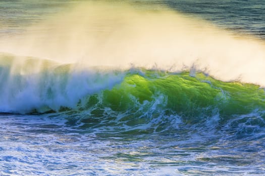 Texture of Ocean wave at sunset time.