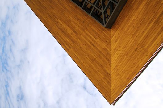 Wooden eaves of the building on a blue sky 