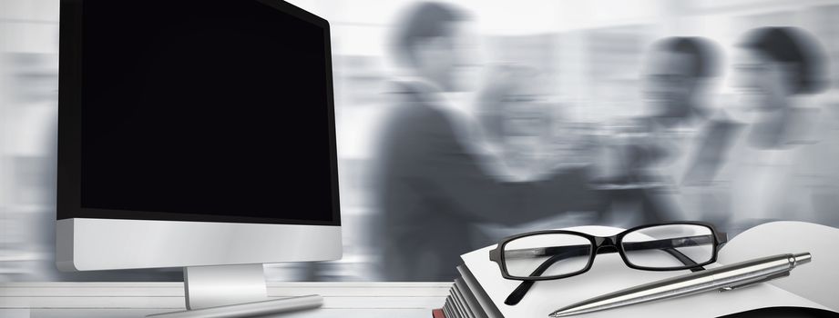 Business team celebrating with champagne and toasting against computer screen