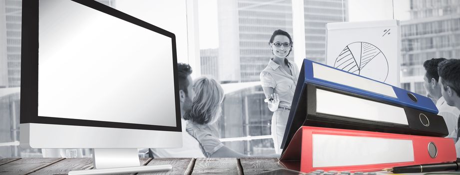 Computer screen against business people in office at presentation