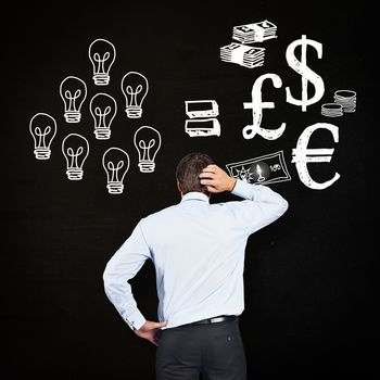 Thinking businessman scratching head against black