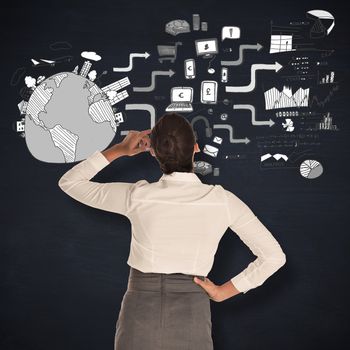 Businesswoman scratching her head against blackboard