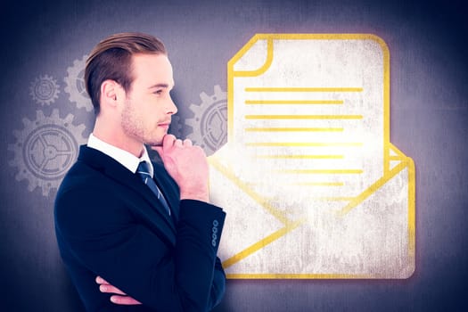 Thinking businessman standing with hand on chin against white and grey background