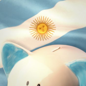 Piggy bank against argentinian flag