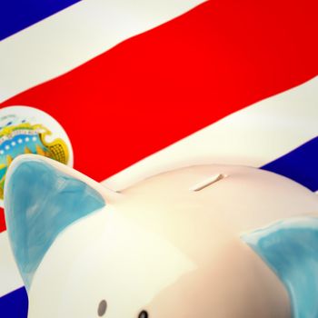 Piggy bank against costa rica national flag