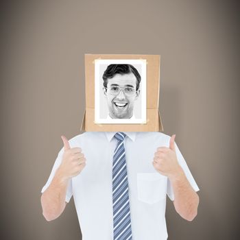 Businessman with photo box on head against grey background with vignette