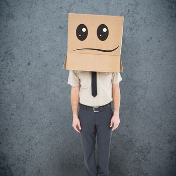 Businessman standing with box on head  against dirty old wall background