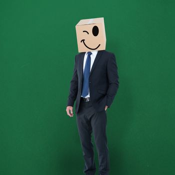 Anonymous businessman against green