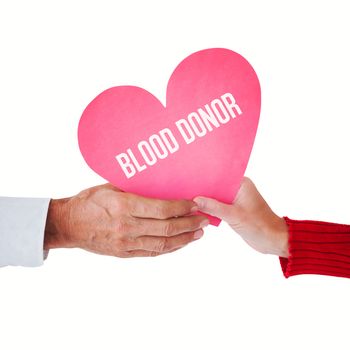 Couple holding heart against blood donor