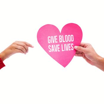 Couple holding a heart against give blood save lives