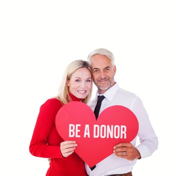 Handsome man getting a heart card form wife against be a donor