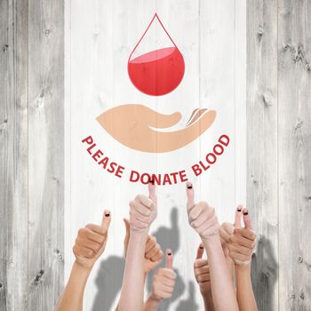 Blood donation against pale wooden planks