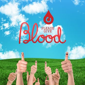 Blood donation against green field under blue sky