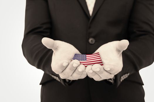 Businessman holding his hands out against usa national flag