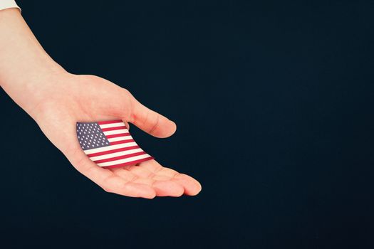 Businesswomans hand presenting against blue background