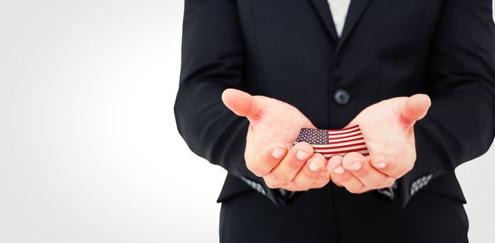 Businessman holding his hands out against usa national flag