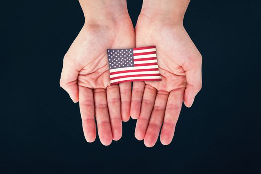 Hands showing against blue background