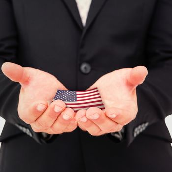 Businessman holding his hands out against usa national flag