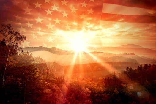 United states of america flag against sunrise over mountains