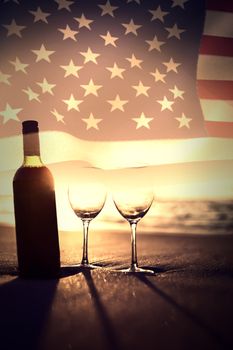 United states of america flag against bottle of vine with two glass