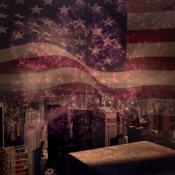 Digitally generated united states national flag against colourful fireworks exploding on black background