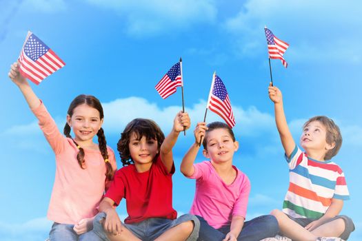 Children with american flags against sky