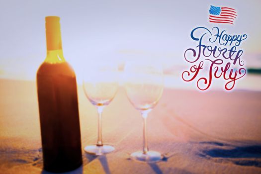 Independence day graphic against bottle of wine with two glasses