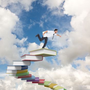 Geeky young businessman running late against blue sky with white clouds