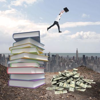 Businessman leaping with his briefcase against stack of books