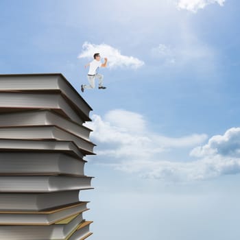 Geeky happy businessman running mid air against blue sky