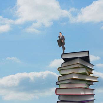 Smiling businessman in a hurry against blue sky with white clouds