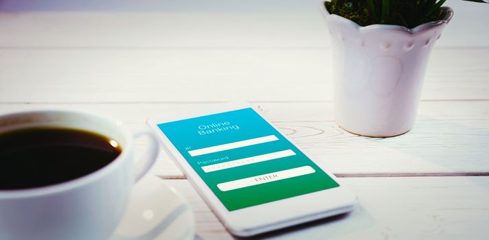Online banking against smartphone on desk
