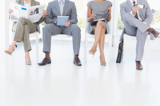 Business people sitting and waiting in the office