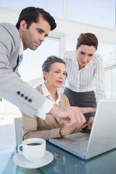 Business partners working on laptop in the office