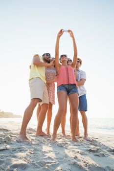 group of friends having fun at the beach