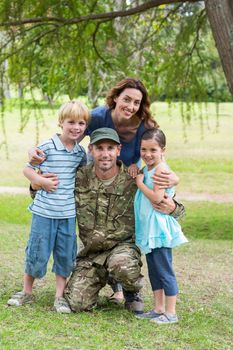 Handsome soldier reunited with family on a sunny day