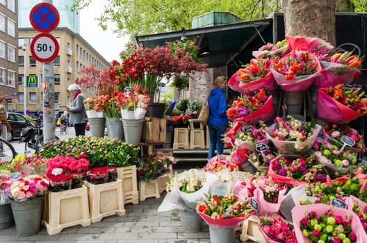 Rotterdam, Netherlands - May 9, 2015: People at Flower shop in Rotterdam, Netherlands. on May 9, 2015.