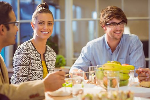 Young business people having lunch together